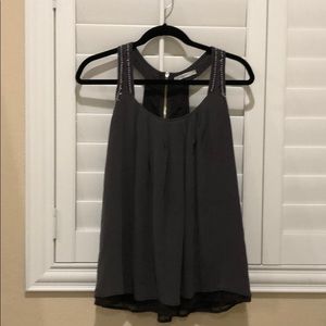 Charcoal gray embellished detail flowy top.